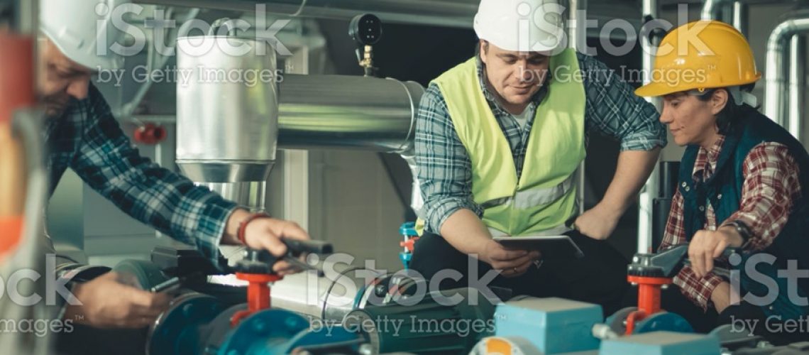 Technicians working in factory or utility